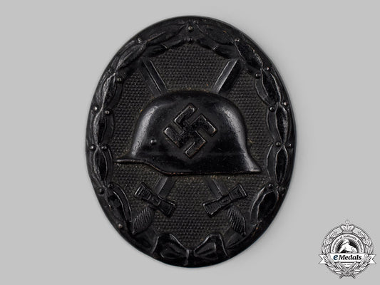 germany,_wehrmacht._an_owner-_attributed_black_grade_wound_badge,_by_carl_wild_68_m21_mnc3034