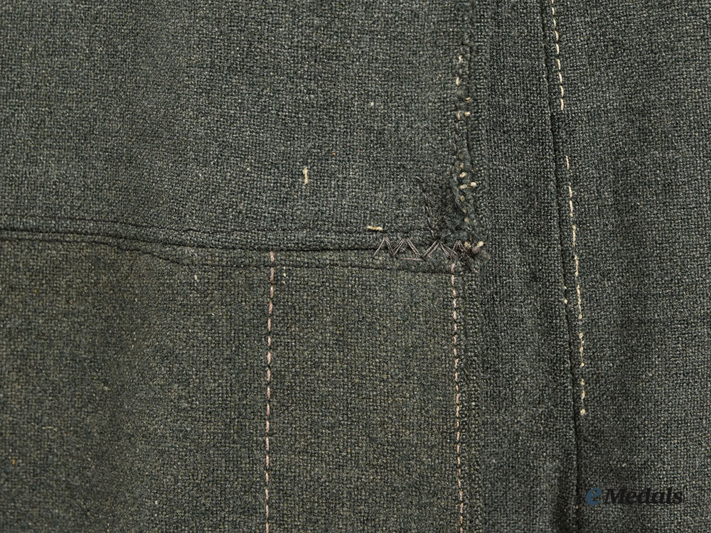 germany,_wehrmacht._a_late_war_de-_badged_uniform_tunic__l22__m_n_c0980_743