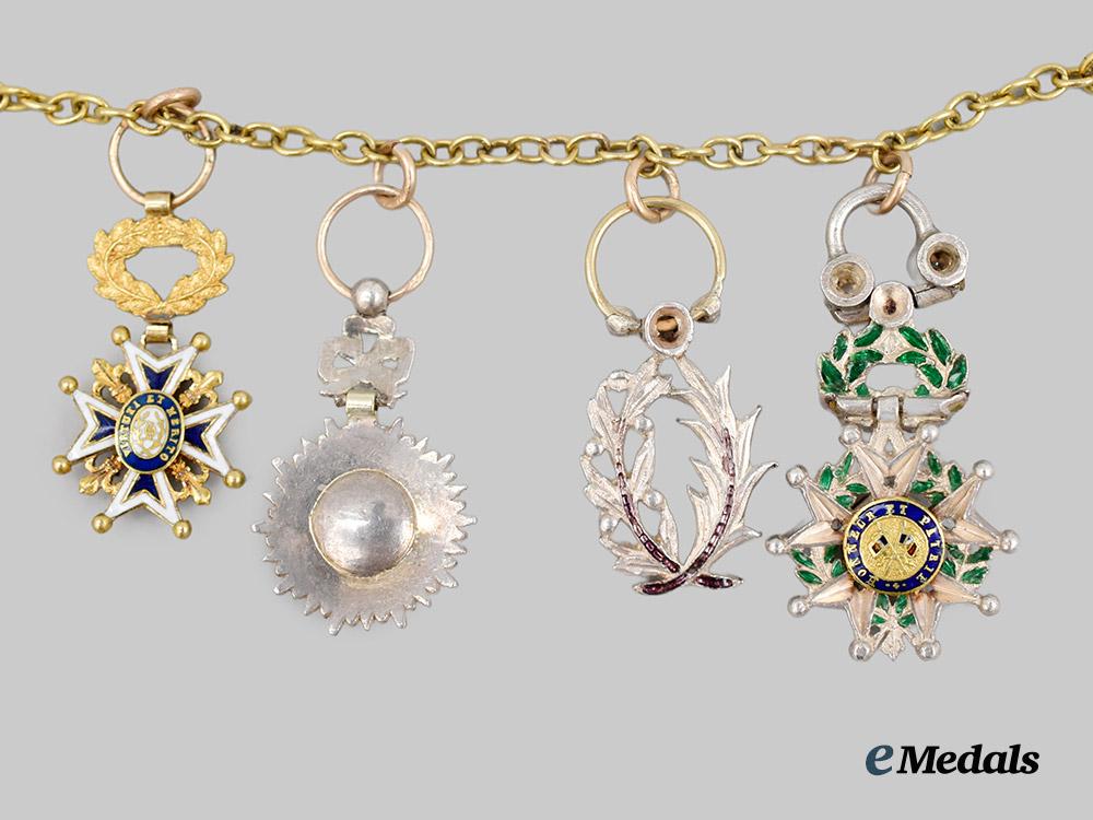 international._an_unusual_miniature_medal_chain_of_four_awards,_with_diamonds___m_n_c0159