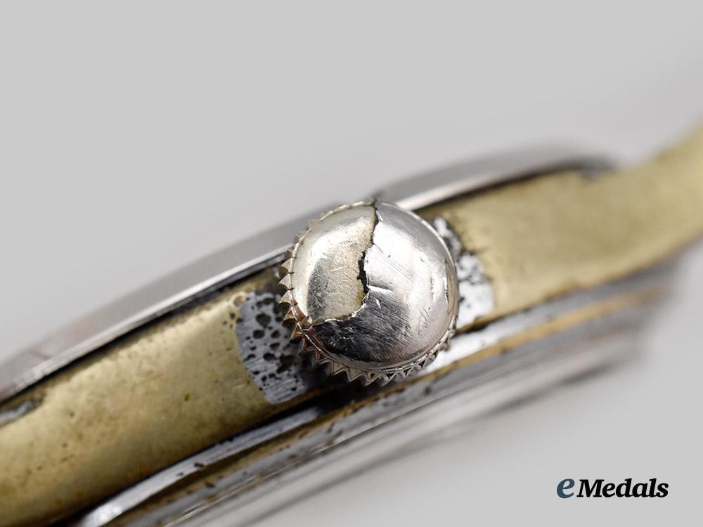 germany,_heer._a_serviceman’s_wristwatch,_by_grana,_allied_retrieval_from_buchenwald___m_n_c0332