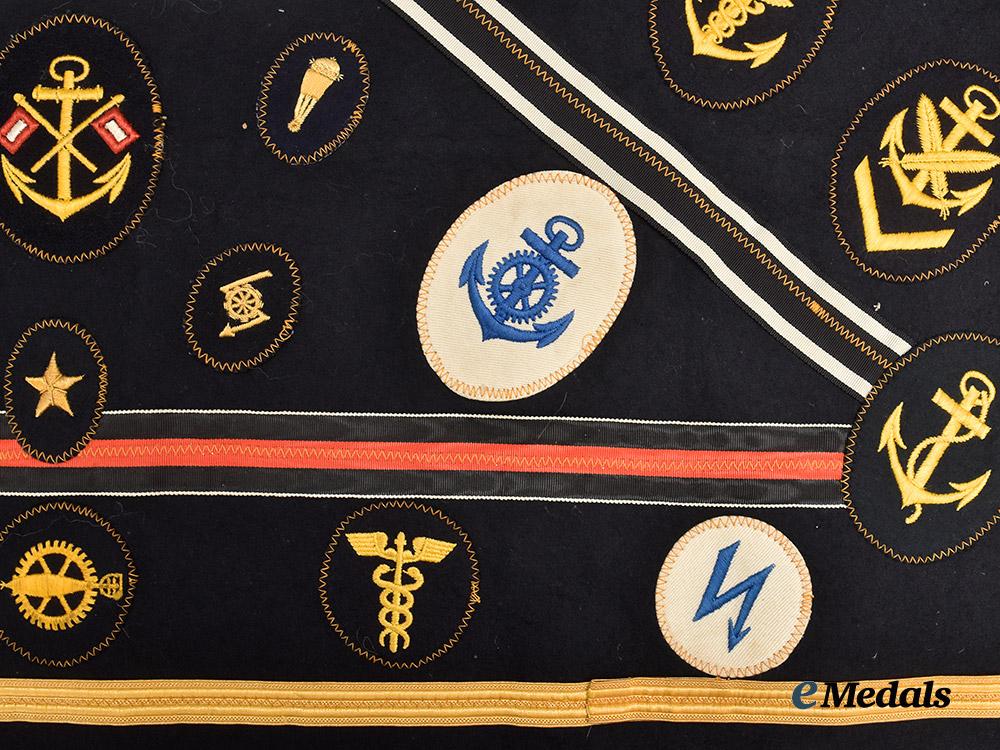 germany,_kriegsmarine._an_allied_souvenir_board_featuring_specialist_insignia_and_medal_ribbons___m_n_c0634