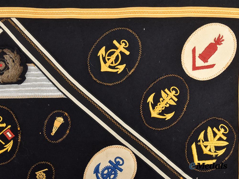 germany,_kriegsmarine._an_allied_souvenir_board_featuring_specialist_insignia_and_medal_ribbons___m_n_c0635