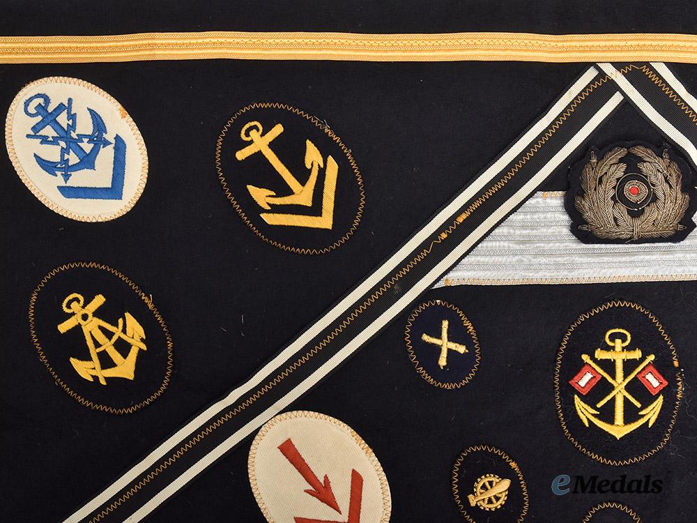 germany,_kriegsmarine._an_allied_souvenir_board_featuring_specialist_insignia_and_medal_ribbons___m_n_c0636