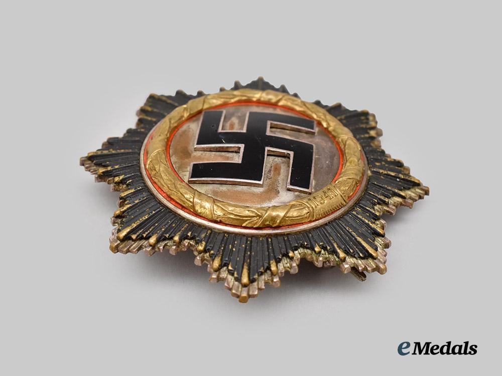 germany,_wehrmacht._a_rare_german_cross_in_gold,_heavy_version,_by_c._e._juncker___m_n_c1710