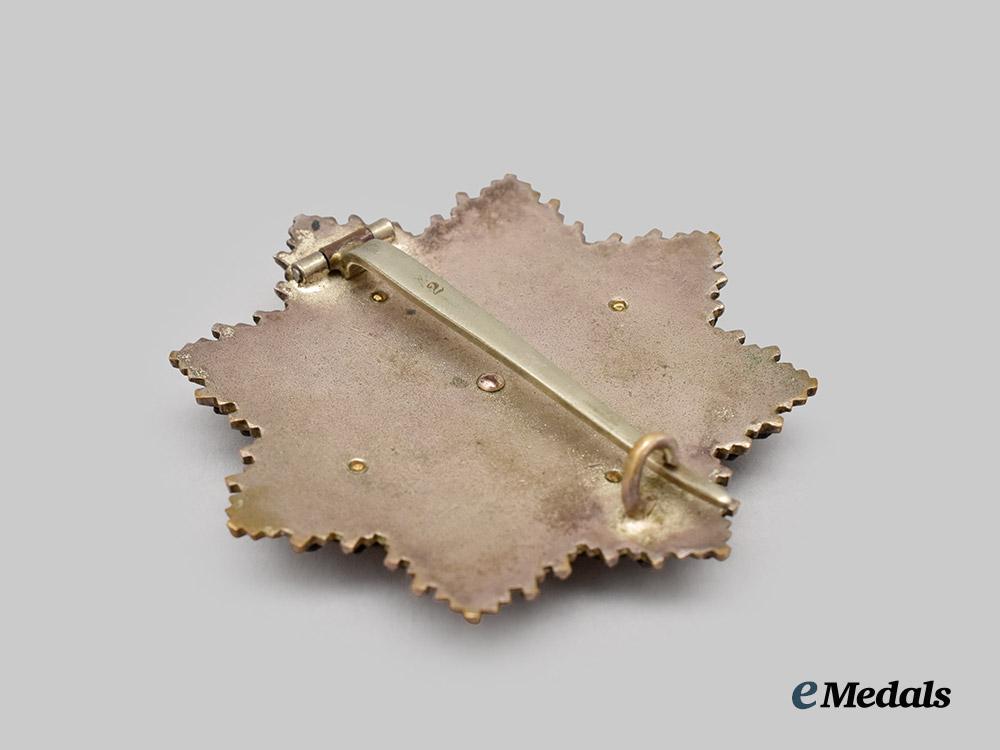 germany,_wehrmacht._a_rare_german_cross_in_gold,_heavy_version,_by_c._e._juncker___m_n_c1712