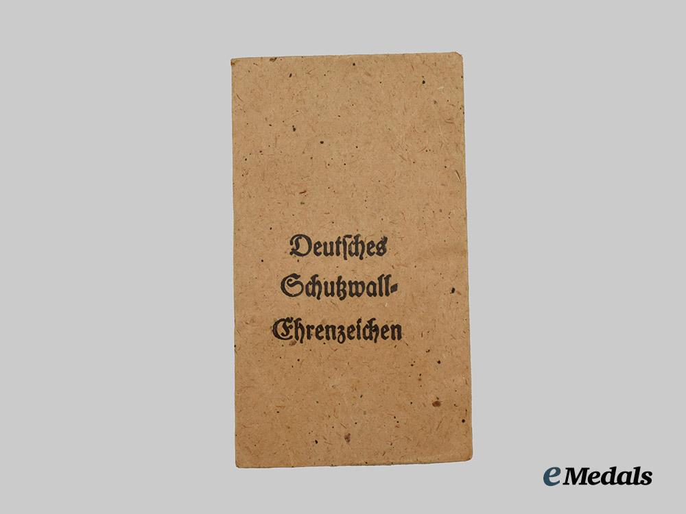 germany,_third_reich._a_west_wall_medal,_with_package,_by_carl_poellath___m_n_c2218