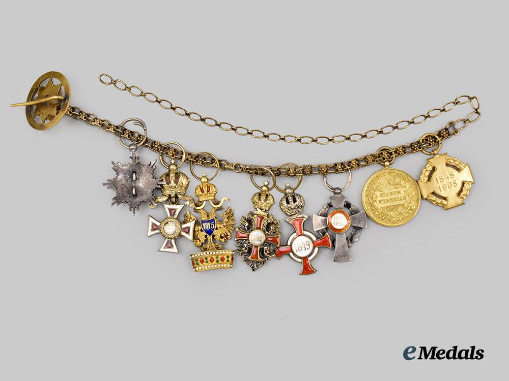 austria,_imperial._a_fine_chain_of_miniature_imperial_orders_by_vincent_mayer,_in_gold,_with_case___m_n_c3100