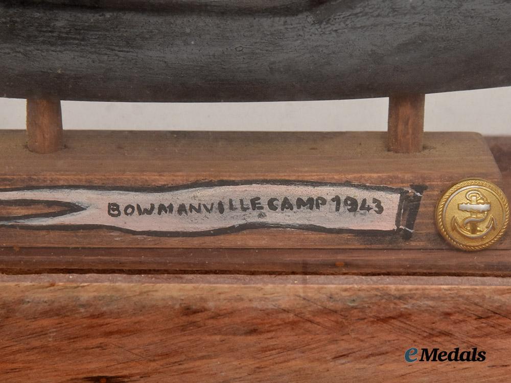 germany,_kriegsmarine._a_cased_model_of_u-99_carved_by_an_inmate_of_bowmanville_p_o_w_camp___m_n_c3211