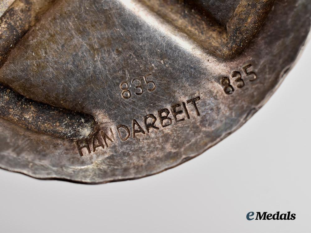 germany,_third_reich._a_germanic_folk_art_swastika_brooch_in_silver___m_n_c3398