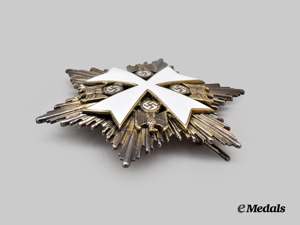 germany,_third_reich._a_rare_order_of_the_german_eagle,_merit_cross_with_breast_star_and_case,_by_gebrüder_godet___m_n_c3995