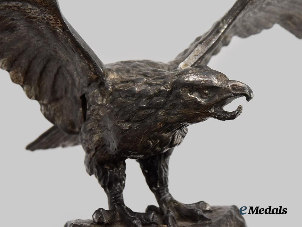 germany,_luftwaffe._a_unique_desk_eagle,_decorated_with_miniature_awards_and_insignia___m_n_c6697