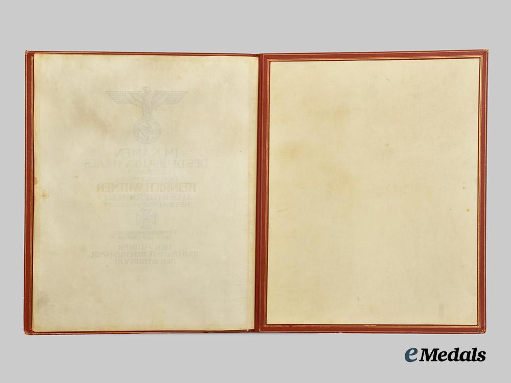 germany,_luftwaffe._a_formal_knight’s_cross_of_the_iron_cross_award_document_to_hauptmann_heinrich_wittmer,_kampfgeschwader55___m_n_c7075