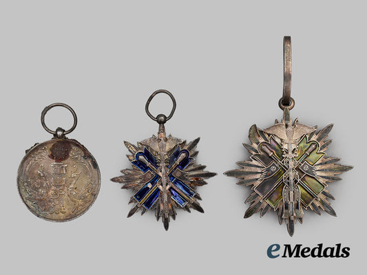japan,_occupied_manchuko._three_recovered_medals_from_the_nagasaki_blast___m_n_c7576