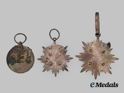 japan,_occupied_manchuko._three_recovered_medals_from_the_nagasaki_blast___m_n_c7577