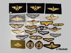 International. A Lot of Twenty-Four Military and Civilian Cloth Wings and Cap Badges