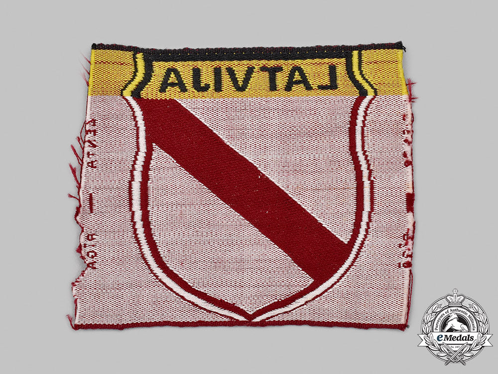 germany,_wehrmacht._a_latvian_volunteer’s_sleeve_shield,_by_lenta_47_m21_mnc1011