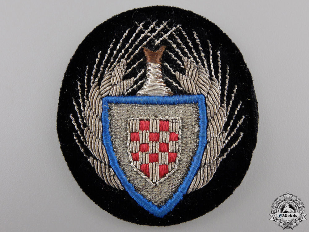 a_croatian_high_officer's_cap_badge_of_the_national_labor_service_a_croatian_high__553fd5c172ab7