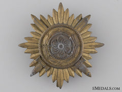 A First Class Ostvolk Decoration; Gold Grade With Swords