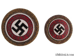 A Pair Of Golden Party Badges