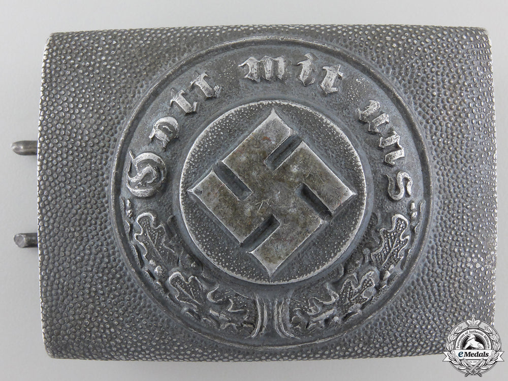 a_police_belt_buckle;_marked_a_police_belt_bu_55c2334317ca6