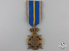 A Romanian Loyal Service Cross With Crossed Swords; 3Rd Class
