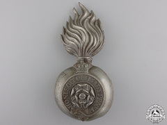 A Victorian Royal Fusiliers Grenade Badge