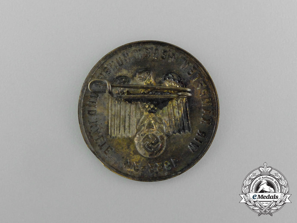 a1933/34_whw(_winter_relief_of_the_german_people)_donation_badge_aa_1480