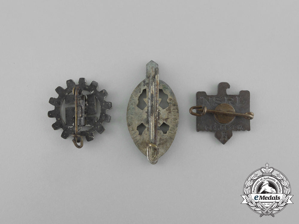 a_grouping_of_three_second_war_german_membership_badges_aa_6515