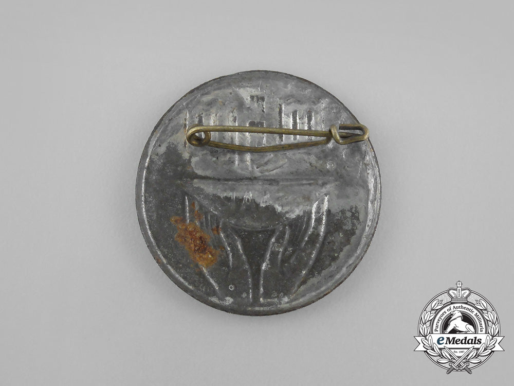 a_third_reich_period_saar_whw(_winter_aid_of_the_german_people)_donation_badge_aa_8838