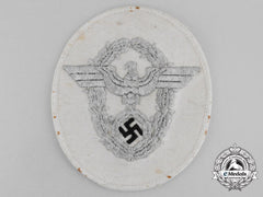 An Unissued German Police Officer’s Bullion Sleeve Eagle; White Uniform