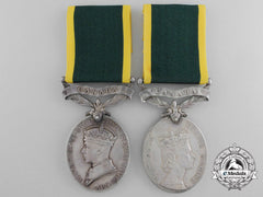 A Father & Son Efficiency Medals With Canada Scroll