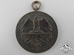 A Second War German Blood And Soil Merit Medal