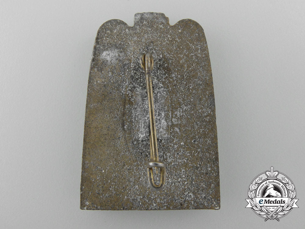 an1937_international_paris_exposition_badge_b_8830