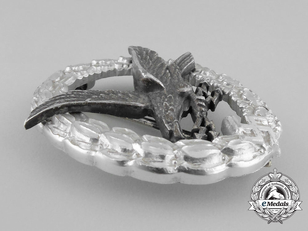 a_cased_luftwaffe_radio_operator_badge_by_hermann_aurich;_aluminum_version_bb_2670