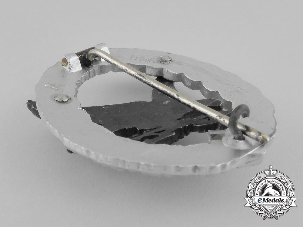a_cased_luftwaffe_radio_operator_badge_by_hermann_aurich;_aluminum_version_bb_2671
