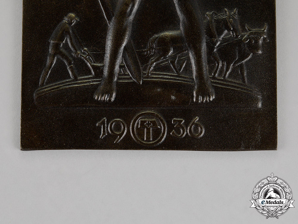 germany,_third_reich._a_patriotic_farmer’s“_sword_and_plow”_ideology_plaque,_c.1936_c18-013768_1_1