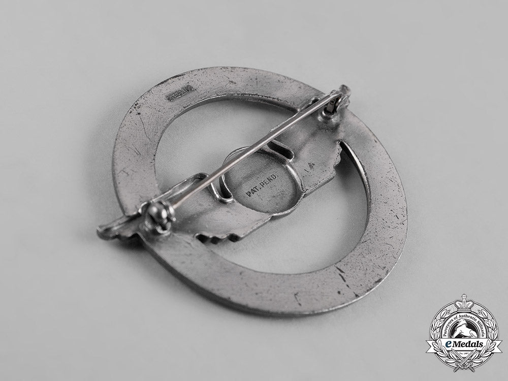 united_states._a_civil_aeronautics_administration(_caa)_war_training_service_cap_badge_c19-1210