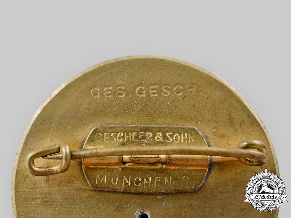 germany,_nsdap._a_pair_of_golden_parties_badges_c2020_082_mnc0731