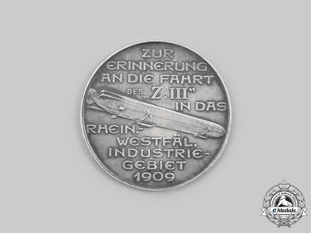 germany,_imperial._a_count_ferdinand_von_zeppelin_thaler_flight_of_z.iii_to_the_rhein-_westfalia_industrial_area_medal1909_c2020_424_mnc7521_1