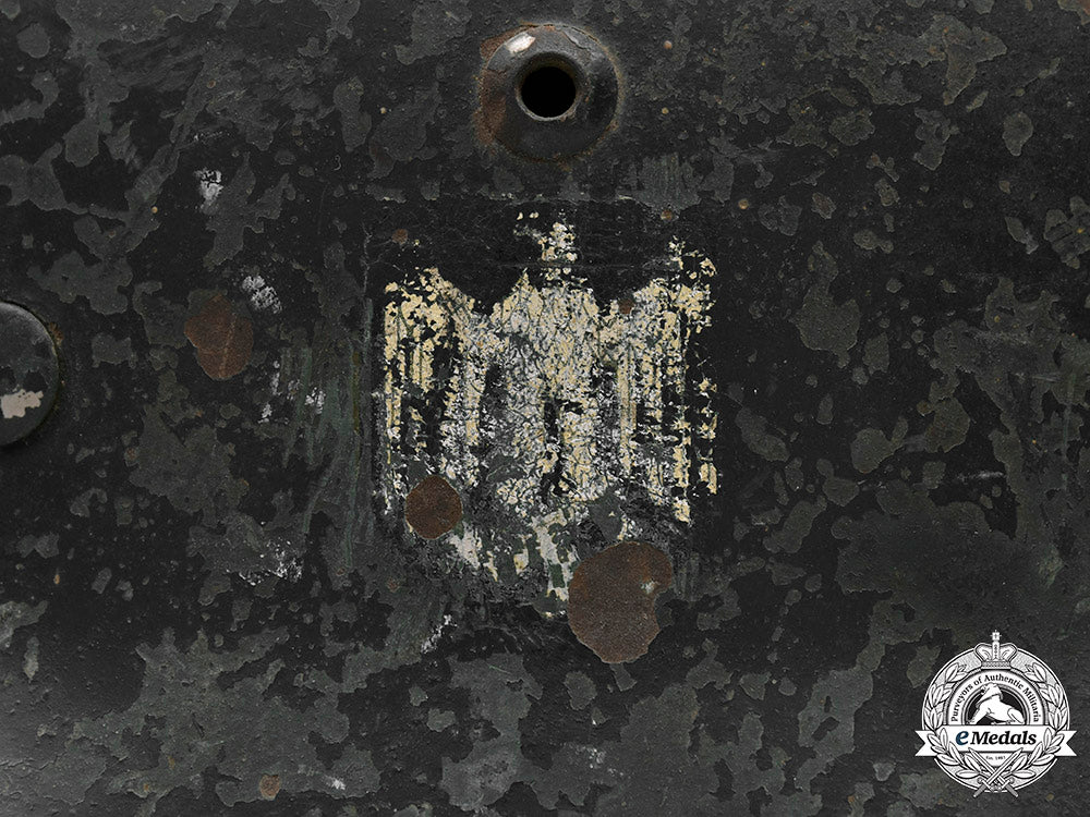 germany,_heer._a_battle-_damaged_heer_m40_steel_helmet_c2020_478_mnc9365_1_1_1_1_1