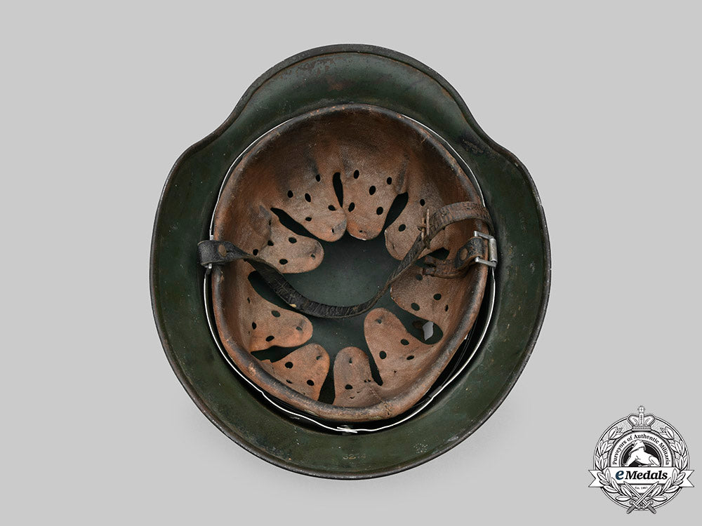 germany,_heer._a_battle-_damaged_heer_m40_steel_helmet_c2020_479_mnc9357_1_1_1_1_1