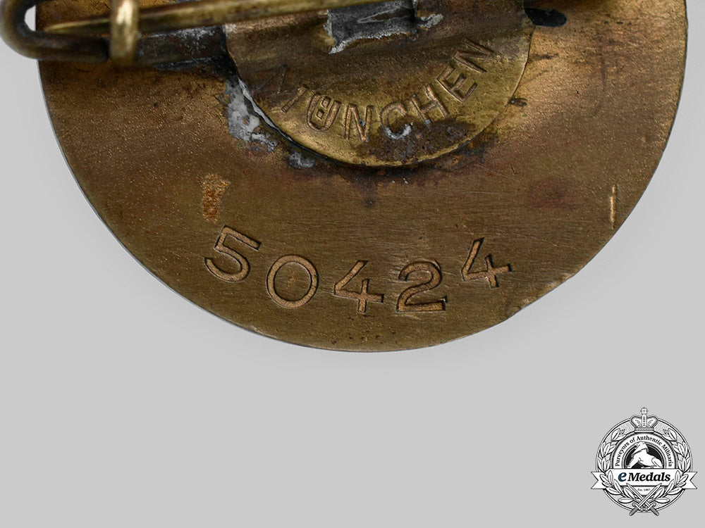 germany,_nsdap._a_golden_party_badge,_small_version,_by_josef_fuess_c2020_981_mnc4028_1_1