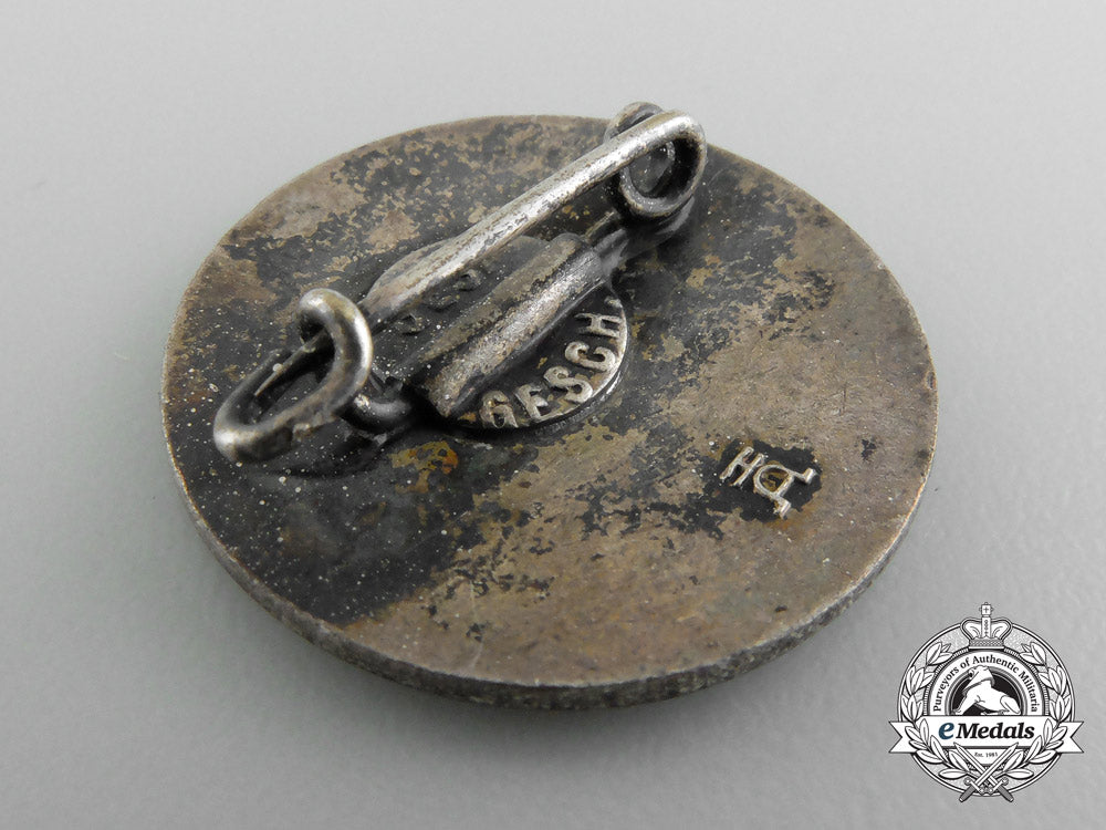 a_german_homeowner’s_membership_badge_c_2434