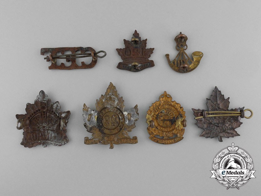 a_lot_of_seven_royal_canadian_military_cap_badges_and_uniform_insignia_c_5297