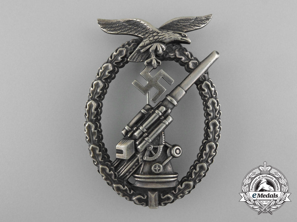 an_early_luftwaffe_flak_badge_in_tombac_with_ball_hinge_c_7352