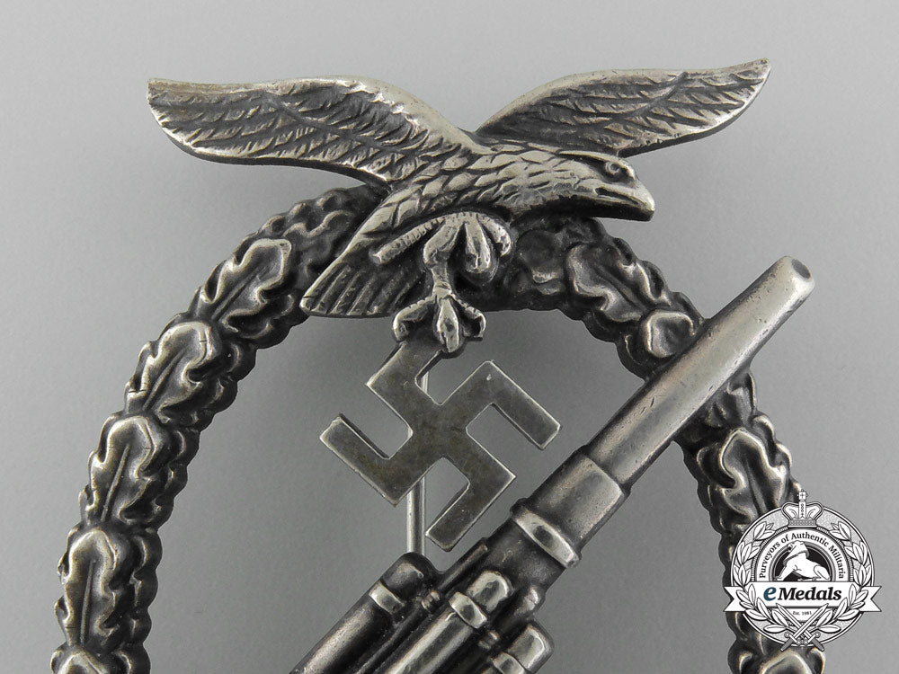 an_early_luftwaffe_flak_badge_in_tombac_with_ball_hinge_c_7353