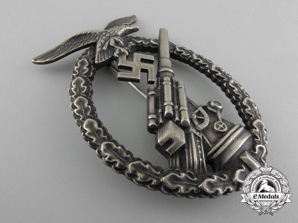 an_early_luftwaffe_flak_badge_in_tombac_with_ball_hinge_c_7355