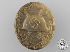 An Early Gold Grade Wound Badge; Marked 30