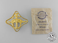 Italy, Fascist State. A Royal Navy Battleships War Navigation Badge with Packet