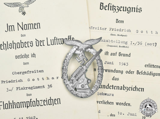 germany,_luftwaffe._a_flak_badge_with_award_documents,_to_obergefreiter_frierich_gotthardt_cic2021__mnc9683
